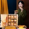 The Spring Glow Tet Gift Set is an elegant pinewood gift box filled with tea, sweets, and snacks, making it the ideal Vietnamese New Year gift or corporate present.