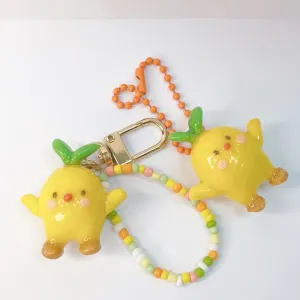 lemon wearing crocs, handmade clay keychain, cute design, bright colors, adorable decorative accessory