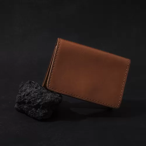trifold brown vachetta wallet, minimalist design, sleek and sophisticated style, a gift for friends and family