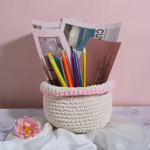 white with light pink border crochet cotton basket, sturdy, durable basket, home decor accessory, storing study supplies, a plant pot cover