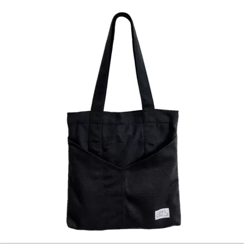 black canvas tote bag, minimalist style, square shape, sturdy shoulder strap, convenient and versatile, suitable for various styles