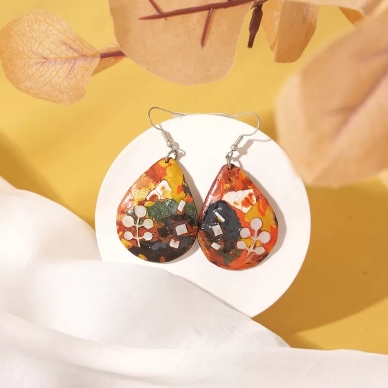 medium water drop earrings with lacquered pattern, rustic material, unique artistic lacquer patterns, eye-catching, unique earrings