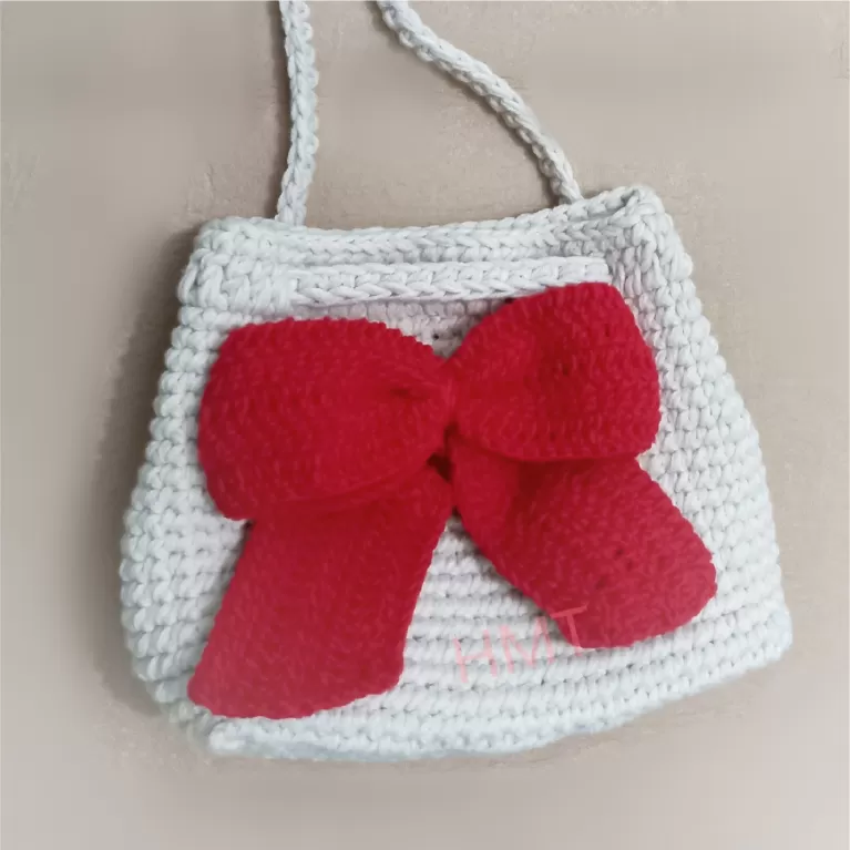 lovely bow crochet bag, handcrafted crochet, versatile drawstring design, durable, versatile strap, fashionable style