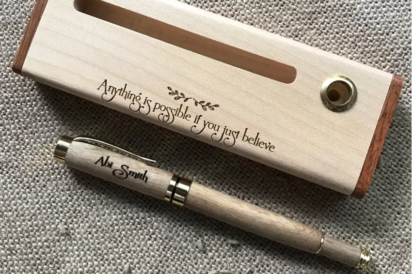 Elegant writing pen made from natural materials, with artistic engraving details